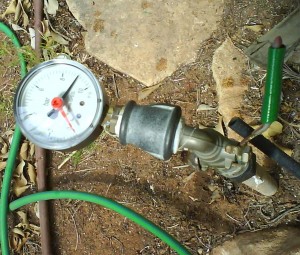 Pressure gauge at home garden showing 9 bars